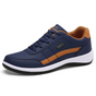 Men's low-top lace-up sneakers with contrast stripe and layered sole