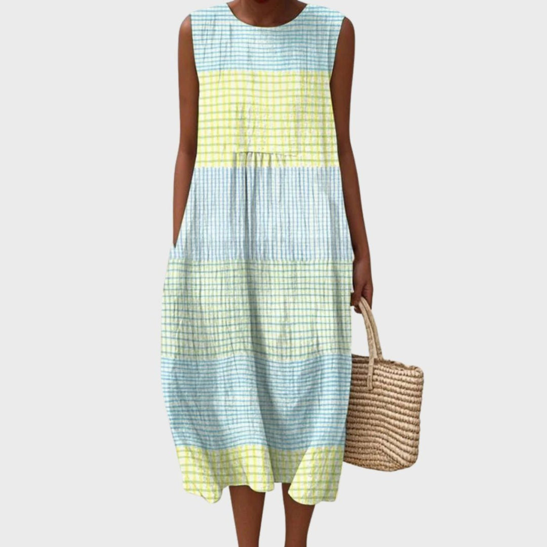 Women's sleeveless tiered midi dress in blue, yellow and green plaid colour block.
