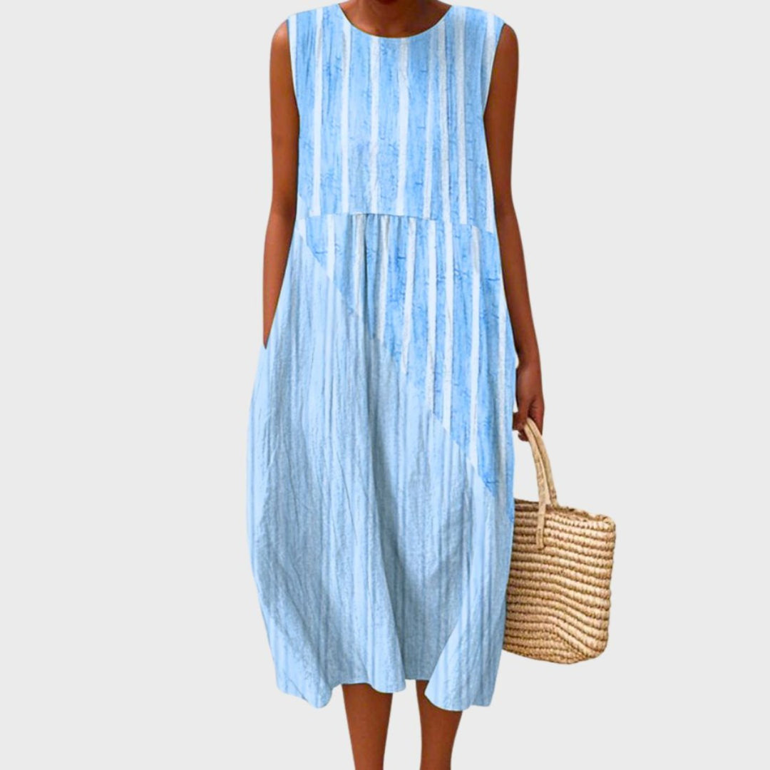 Women's sleeveless tiered midi dress in blue, yellow and green plaid colour block.