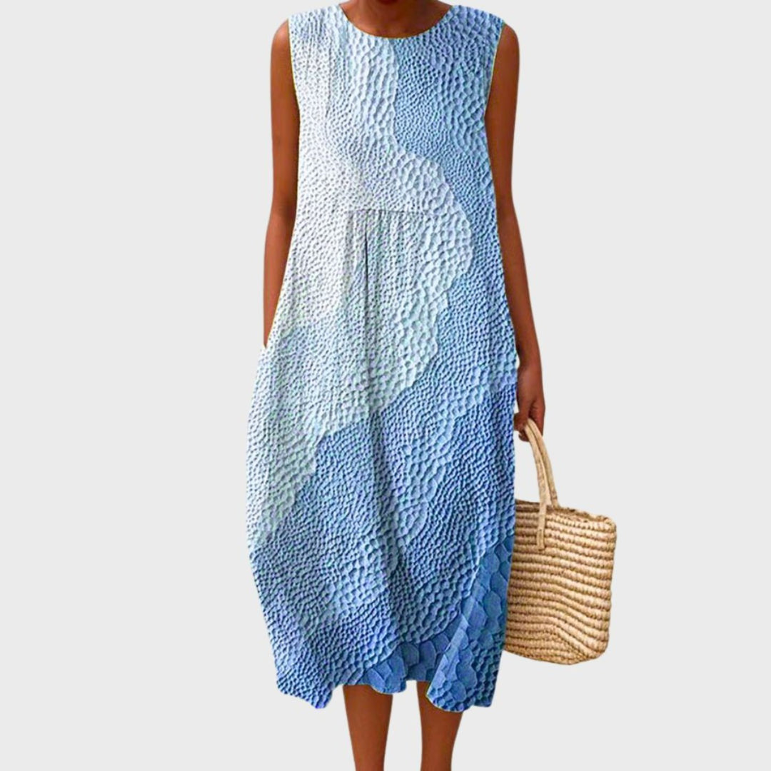 Women's sleeveless tiered midi dress in blue, yellow and green plaid colour block.