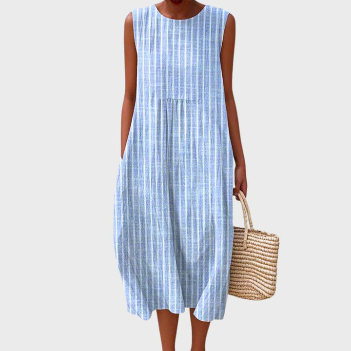 Women's sleeveless tiered midi dress in blue, yellow and green plaid colour block.