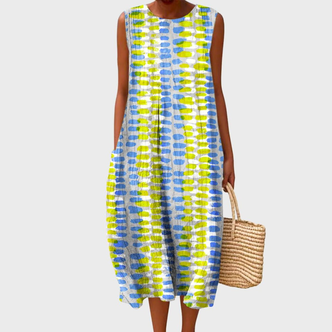 Women's sleeveless tiered midi dress in blue, yellow and green plaid colour block.