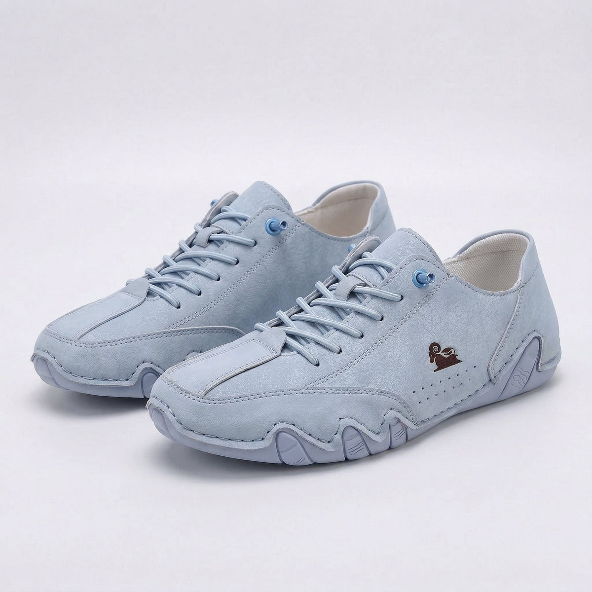 Low-top lace-up sneakers with round toes, stitched panels and segmented soles