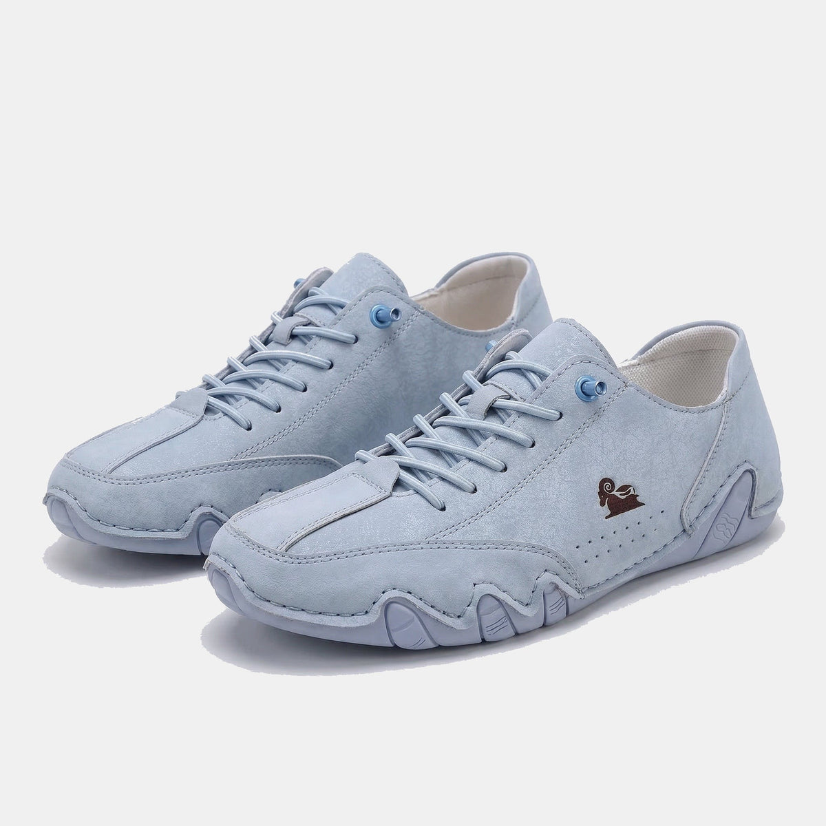 Low-top lace-up sneakers with round toes, stitched panels and segmented soles
