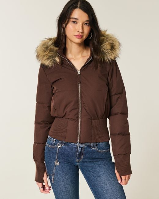Women's cropped quilted jacket with hood and faux fur trim