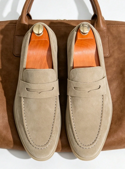 Men's penny loafers with moc toe stitching, penny strap and low heel