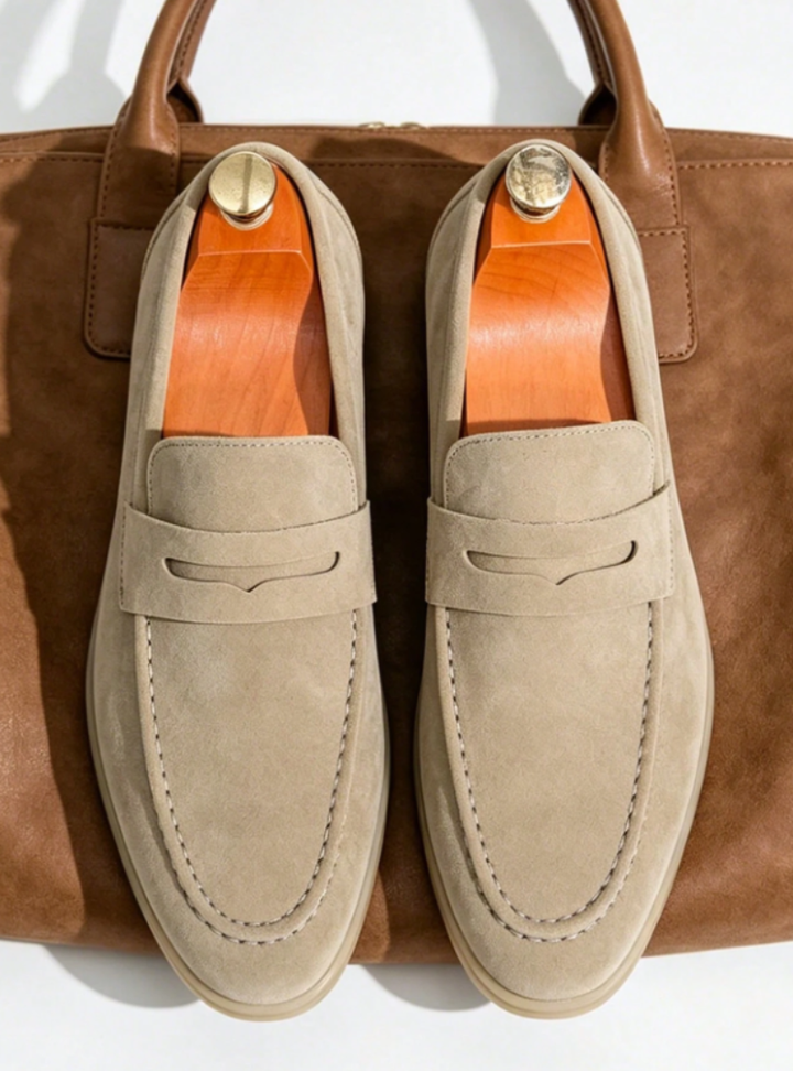 Men's penny loafers with moc toe stitching, penny strap and low heel