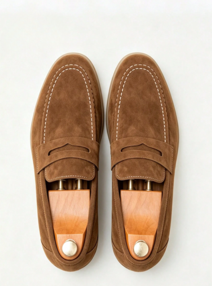 Men's penny loafers with moc toe stitching, penny strap and low heel