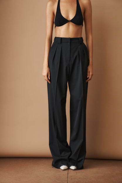 Women's black high-waisted wide-leg pleated pants with belt loops and side pockets