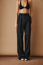Women's black high-waisted wide-leg pleated pants with belt loops and side pockets