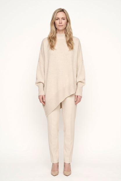 Women's oversized mock neck sweater with long sleeves and asymmetric hem