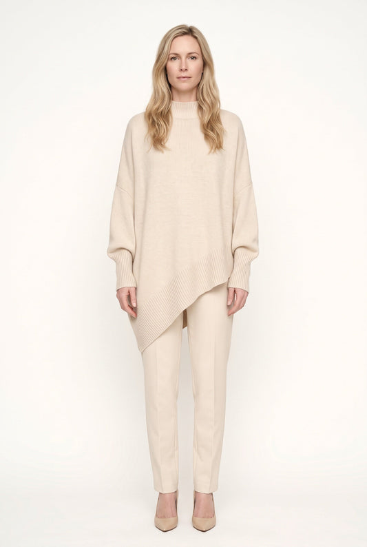 Women's oversized mock neck sweater with long sleeves and asymmetric hem