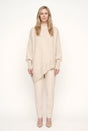 Women's oversized mock neck sweater with long sleeves and asymmetric hem