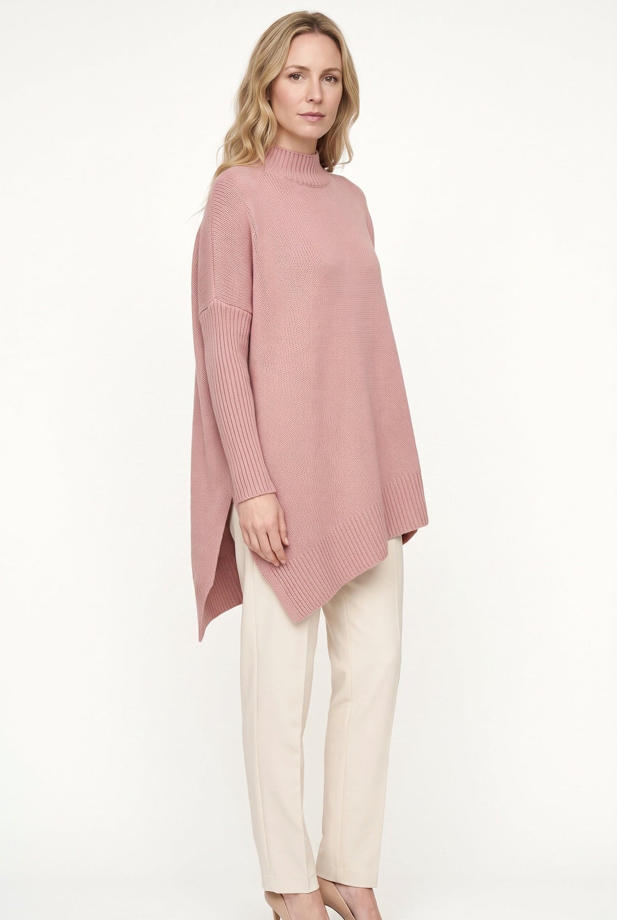 Women's oversized mock neck sweater with long sleeves and asymmetric hem