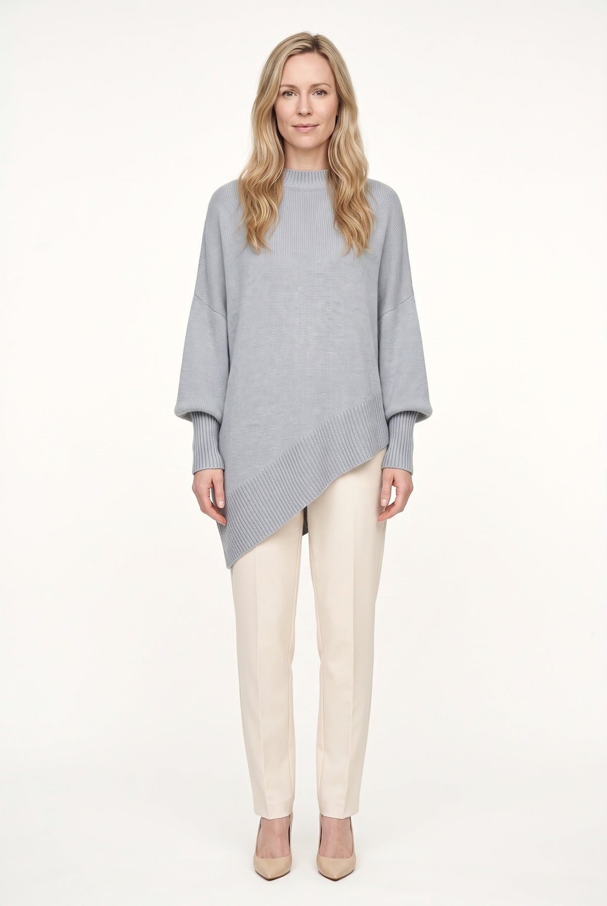 Women's oversized mock neck sweater with long sleeves and asymmetric hem