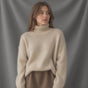 Women's oversized turtleneck sweater with long sleeves and ribbed trims