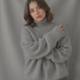Women's oversized turtleneck sweater with long sleeves and ribbed trims