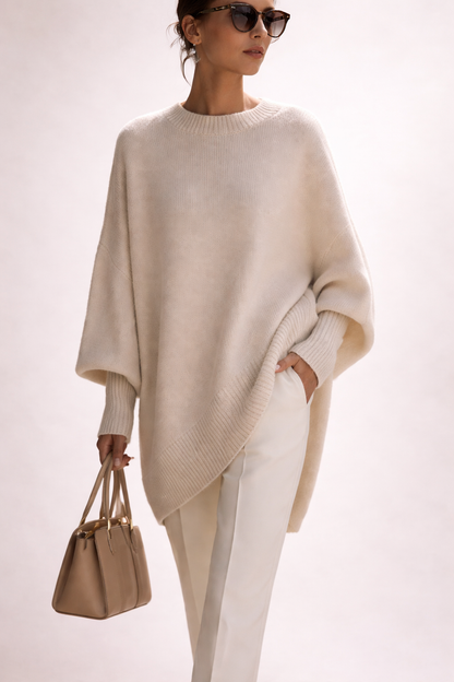 Women's oversized poncho sweater with crew neck and ribbed cuffs