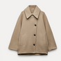 Women's oversized coat with point collar, button front and two welt pockets
