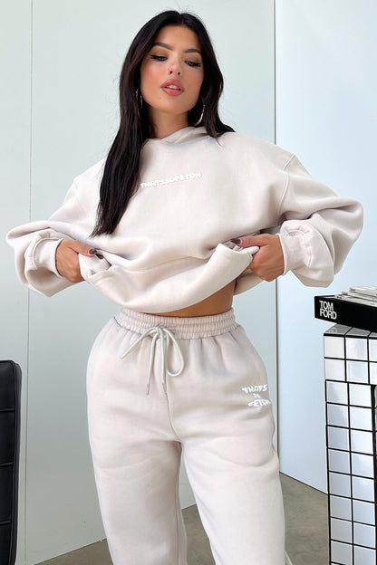 Women's beige oversized hoodie with hood, long sleeves and front kangaroo pocket