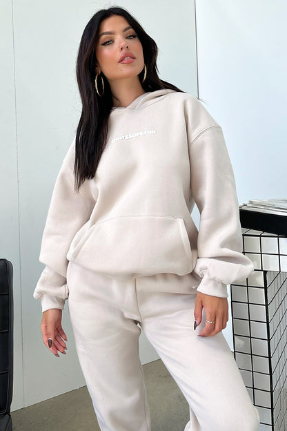 Women's beige oversized hoodie with hood, long sleeves and front kangaroo pocket