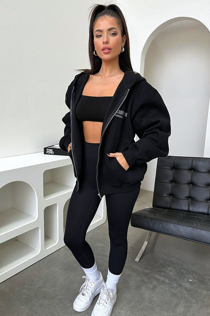 Women's black cropped zip-up hoodie with hood, long sleeves and chest lettering