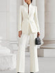 Women's tailored suit with high collar blazer and wide-leg trousers