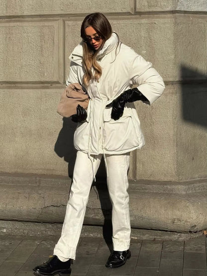 Women's beige padded puffer coat with stand collar, long sleeves and flap pockets