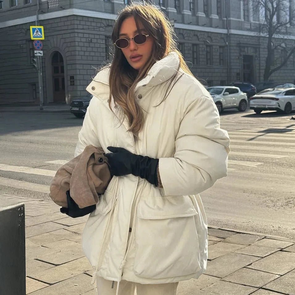 Women's beige padded puffer coat with stand collar, long sleeves and flap pockets