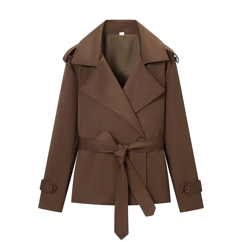Women's brown cropped trench coat with wide lapels and tie belt