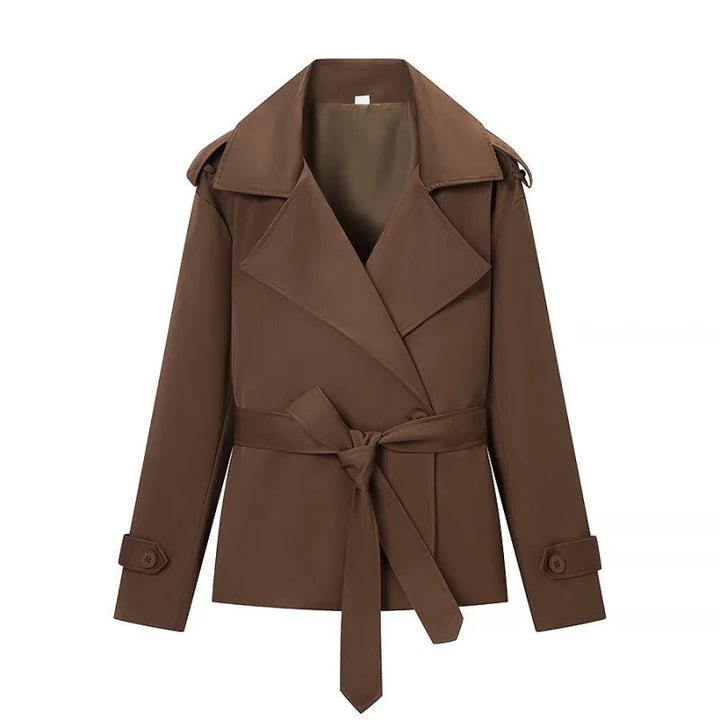 Women's brown cropped trench coat with wide lapels and tie belt