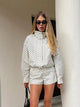 Women's polka dot cropped jacket with high neckline and long sleeves