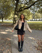 Women's cropped double-breasted trench coat with notched lapels and long sleeves