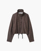 Women's polka dot cropped jacket with high neckline and long sleeves