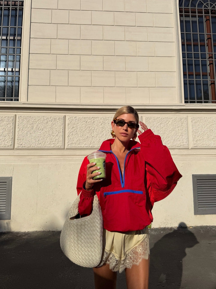 Women's color-block half-zip windbreaker jacket with high collar and zip pocket
