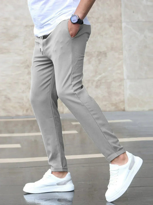 Men's casual tapered trousers with drawstring waist and side pockets