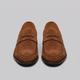 Men's penny loafers with rounded toes and slip-on design