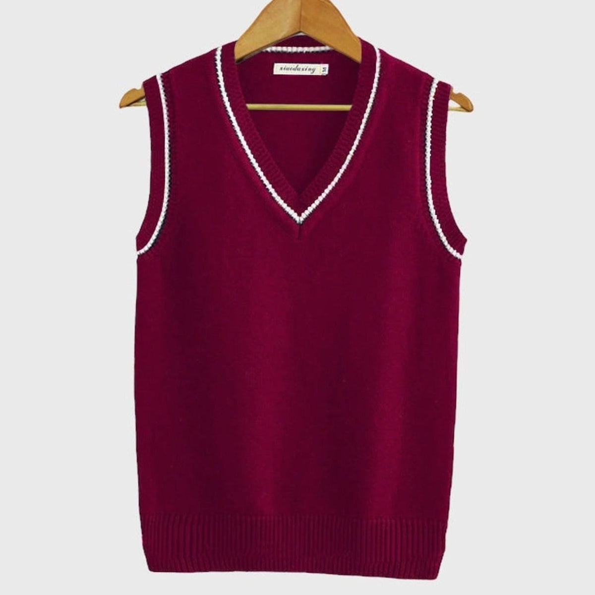 Women's sleeveless cable knit sweater vest with V-neck and ribbed contrast trim