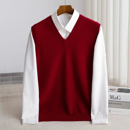 Women's sleeveless V-neck knit sweater vest layered over a white collared shirt