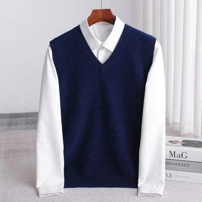 Women's sleeveless V-neck knit sweater vest layered over a white collared shirt