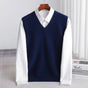 Women's sleeveless V-neck knit sweater vest layered over a white collared shirt