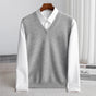 Women's sleeveless V-neck knit sweater vest layered over a white collared shirt