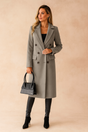 Women's double-breasted long coat with lapels and flap pockets