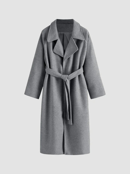 Women's long solid wrap coat with wide lapels and tie belt