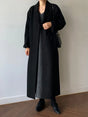 Women's long solid wrap coat with wide lapels and tie belt