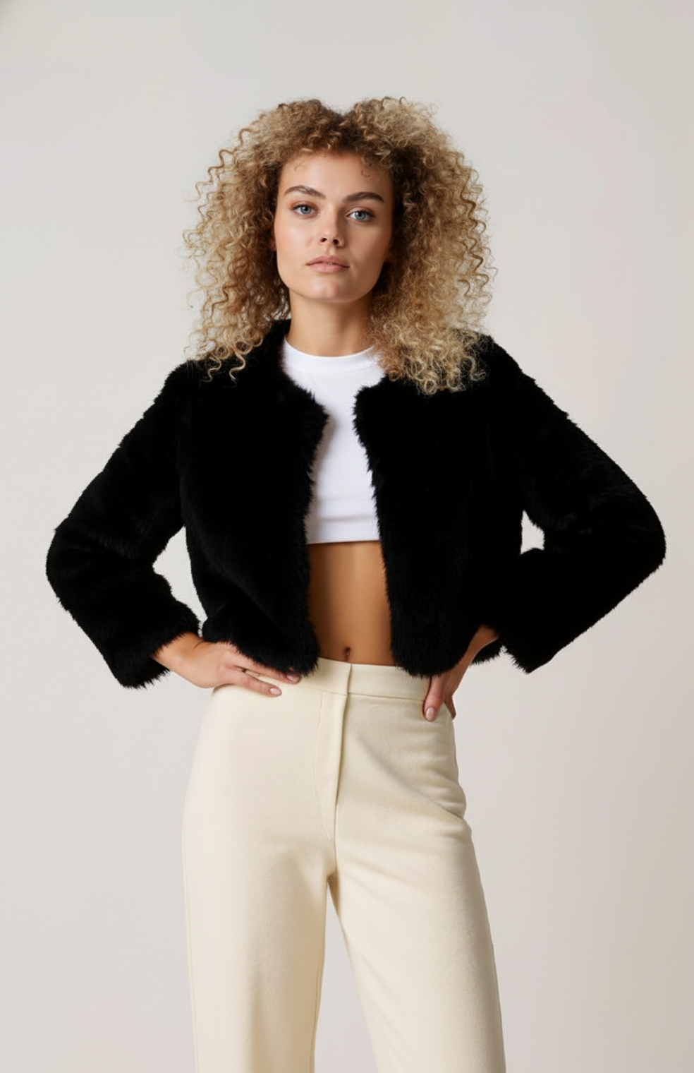Women's short textured jacket shown in beige and black with long sleeves and an open front