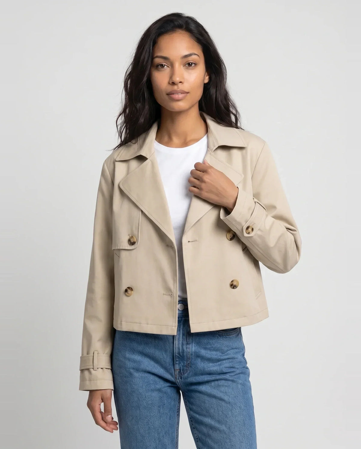 Women's beige cropped double-breasted trench jacket with lapels and cuff straps