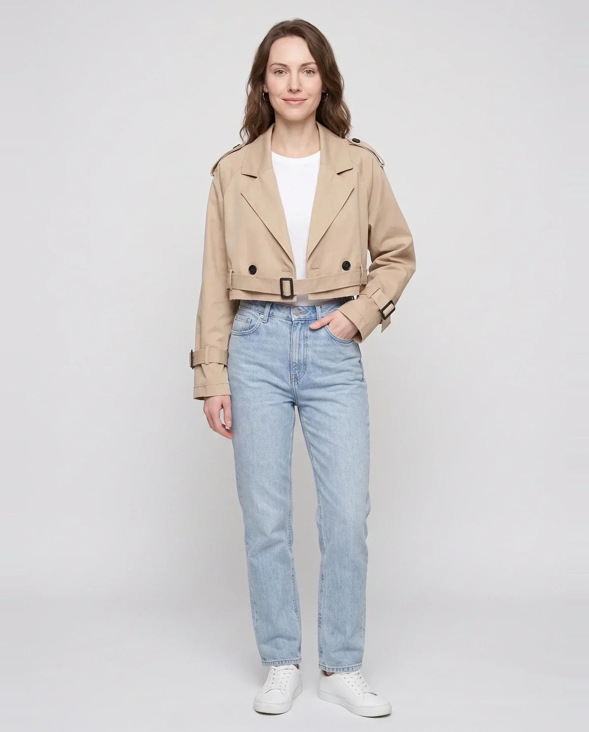 Women's beige cropped trench jacket with buckled belt and long sleeves