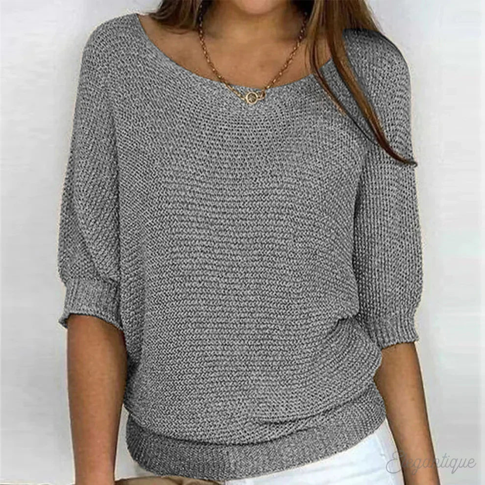 Women's textured knit sweater with wide round neck and three-quarter sleeves