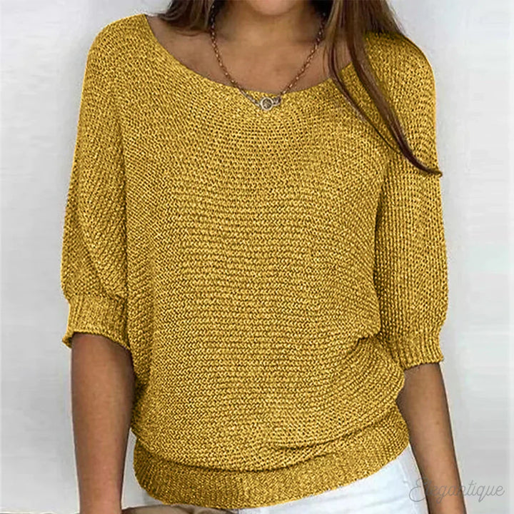 Women's textured knit sweater with wide round neck and three-quarter sleeves